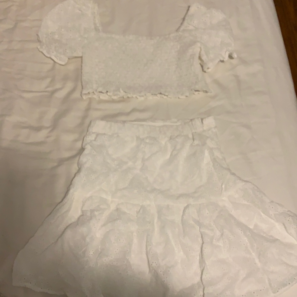 Brand new 2 piece shirt and skirt set.